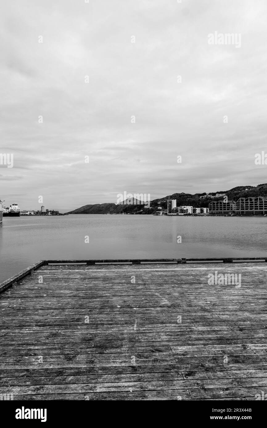 Sandnes, Norway, May 18 2023, Wooden Weathered Aged Boardwalk Or Pier Overlooking The Ocean At Sandnes Harbour With No People Stock Photo