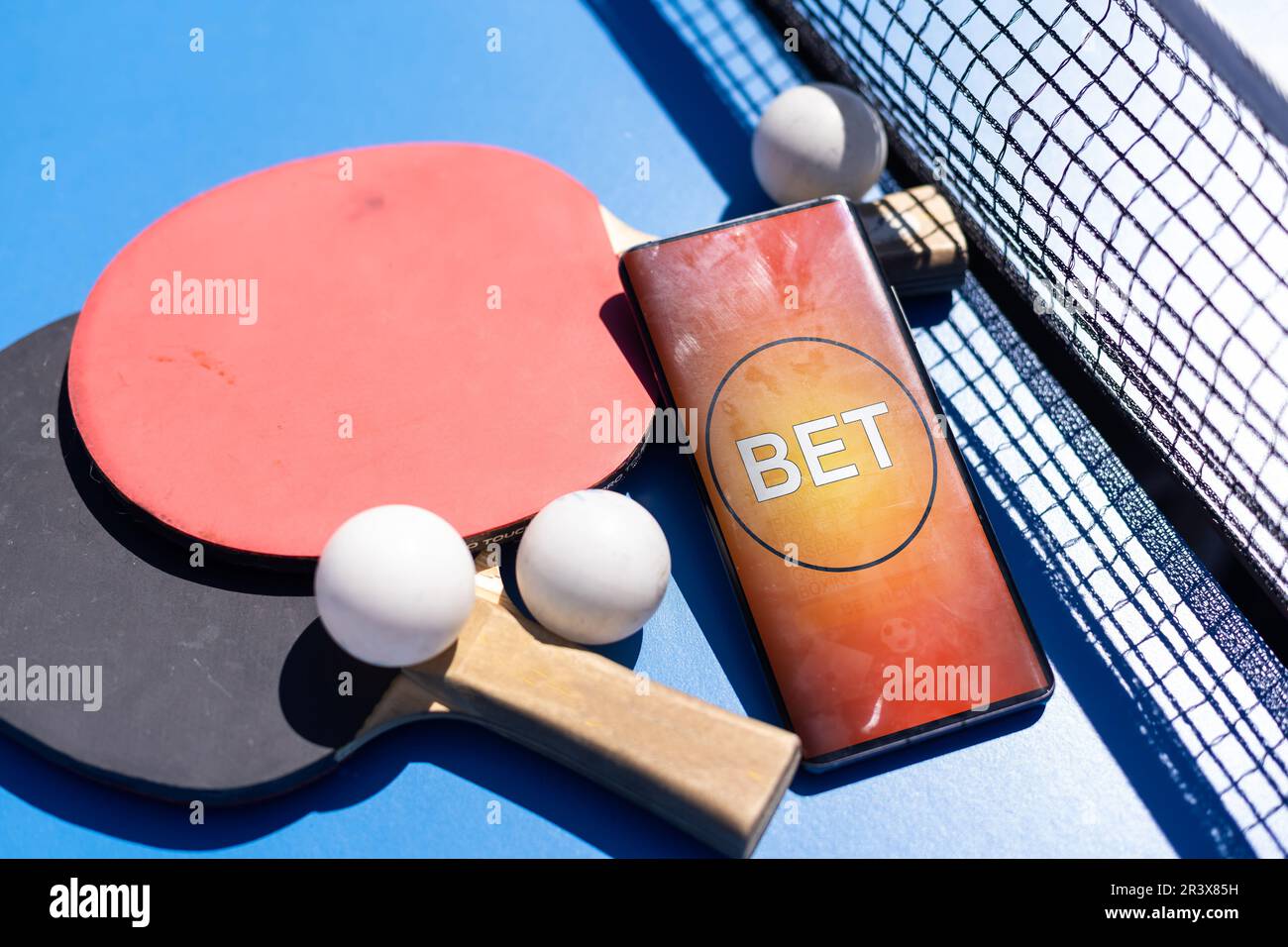 ping pong rackets and balls on a blue background, save space, sport and