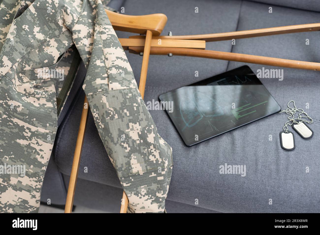 military uniform with crutches and a tablet Stock Photo - Alamy