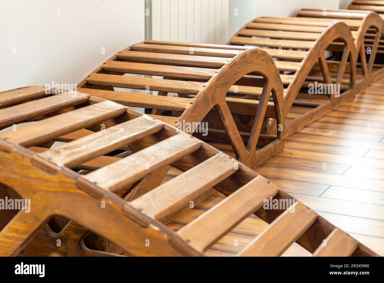 Interior of Gym with yoga wooden benches Stock Photo