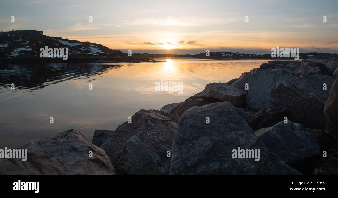Fabulous sunset over the rocky shore of the North Sea in Norway Stock Photo