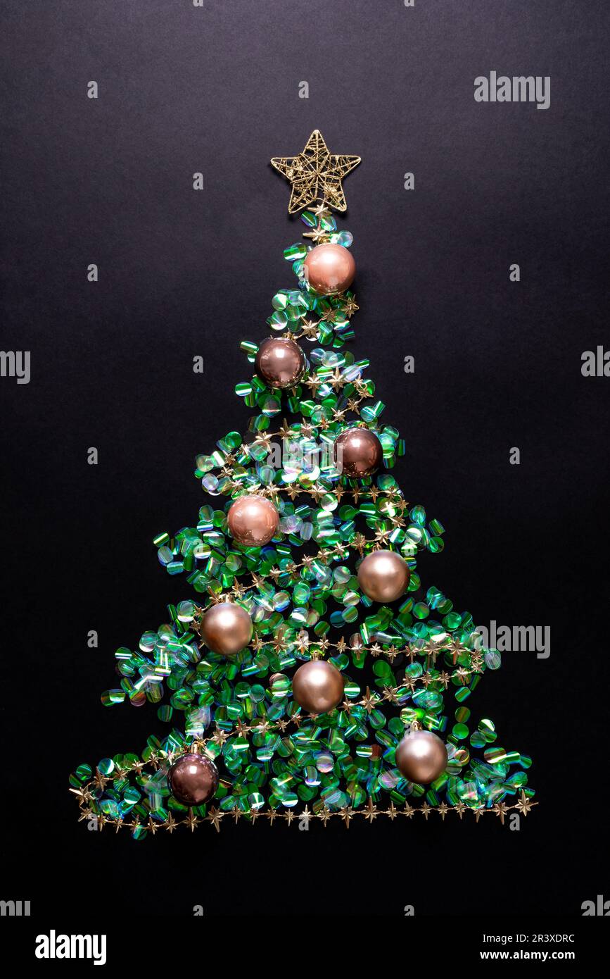Christmas tree with golden str and balls made of green confetti on ...