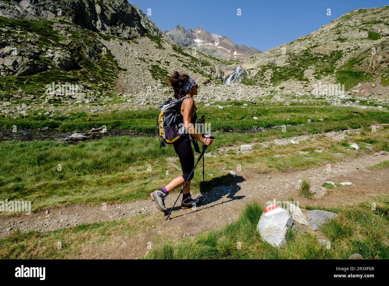 hiker on Ibones azules and Bachimaña alto route, Huesca province, Spain. Stock Photo