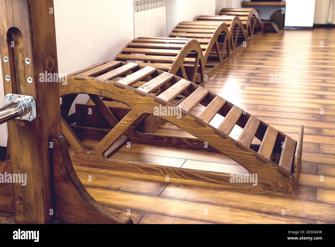Interior of Gym with yoga wooden benches Stock Photo