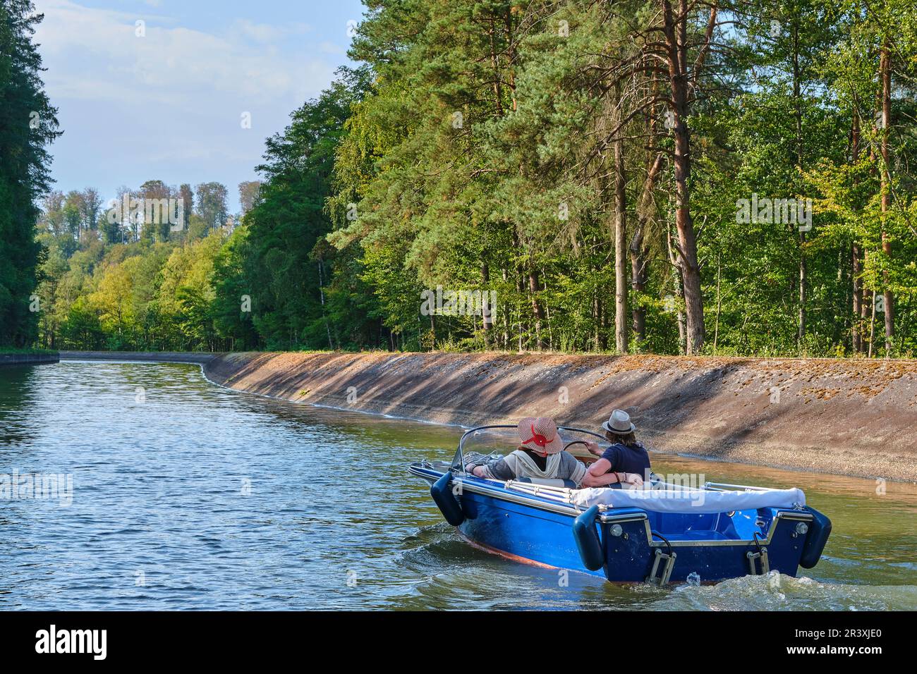 Boat trip on the Canal de la Marne au Rhin (Marne-Rhine Canal), couple on a VINTAGE electric boat between Henridorff and Arzviller (north-eastern Fran Stock Photo