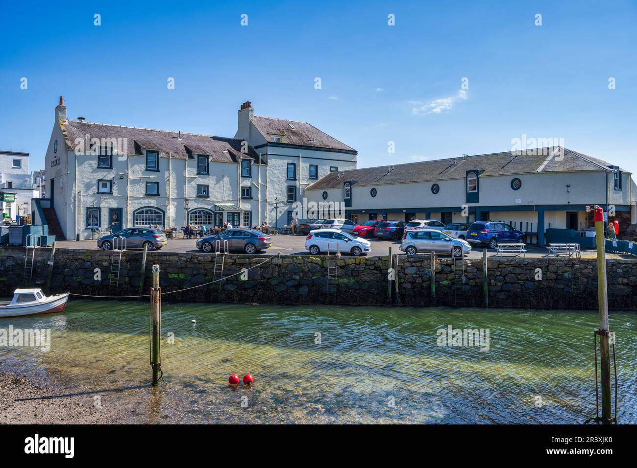 View across river mouth to Crusoe Hotel at Scottish coastal town of Lower Largo in Fife