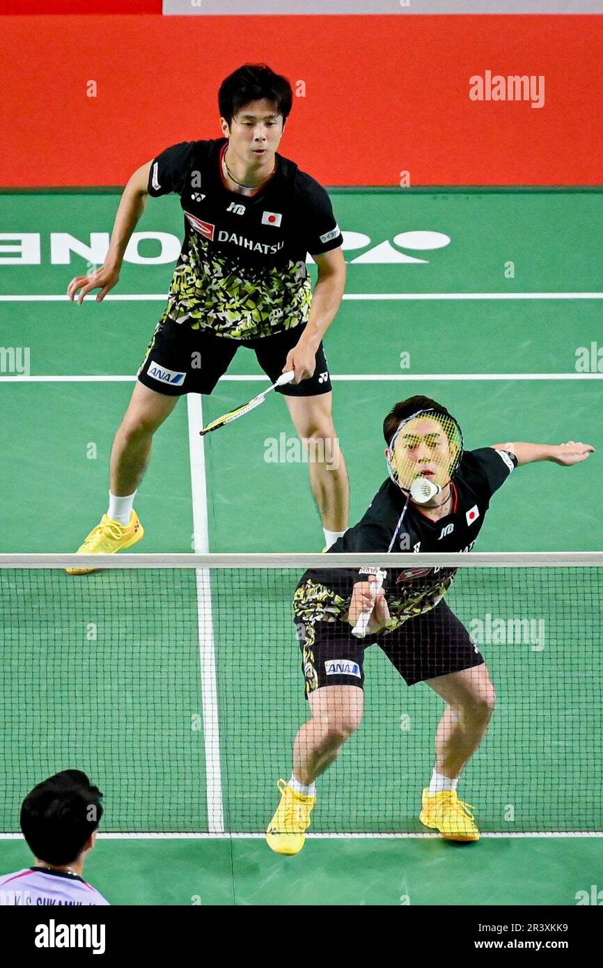 Indonesias Marcus Fernaldi Gideon, top, and Kevin Sanjaya Sukamuljo play against Malaysias Aaron Chia and Soh Wooi Yik during their mens doubles quarterfinal matchat the 2020 Summer Olympics, Thursday, July 29, 2021,