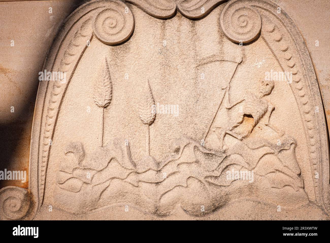 death with a scythe resting next to some cypresses, Inca municipal cemetery, established in 1820, Majorca, Balearic Islands, Spain. Stock Photo