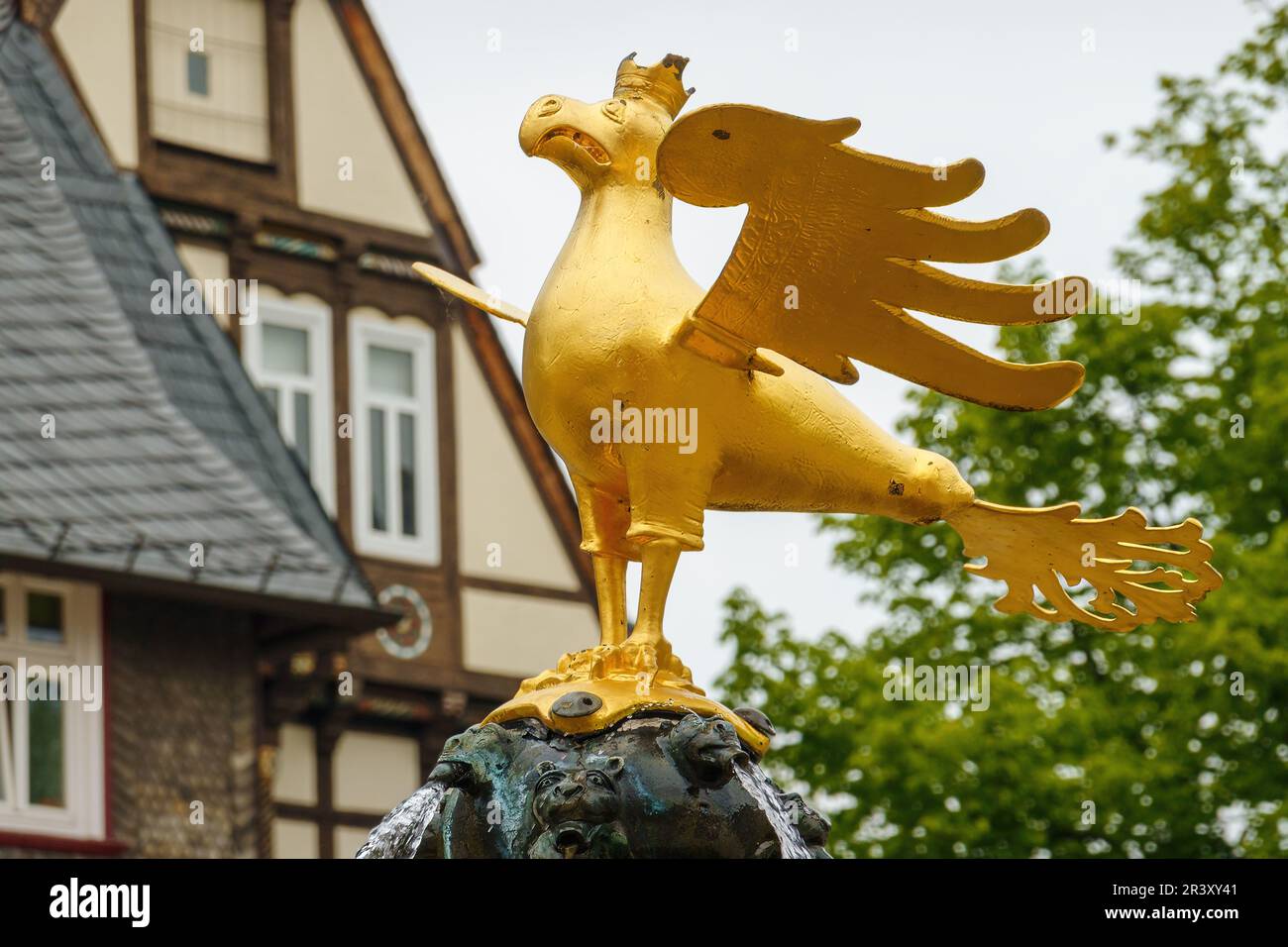 Goslarer Adler, Golden Medieval Imperial Eagle in Goslar, Harz mountains, Lower Saxony, Germany. Market fountain at Market Square. Historic landmark. Stock Photo