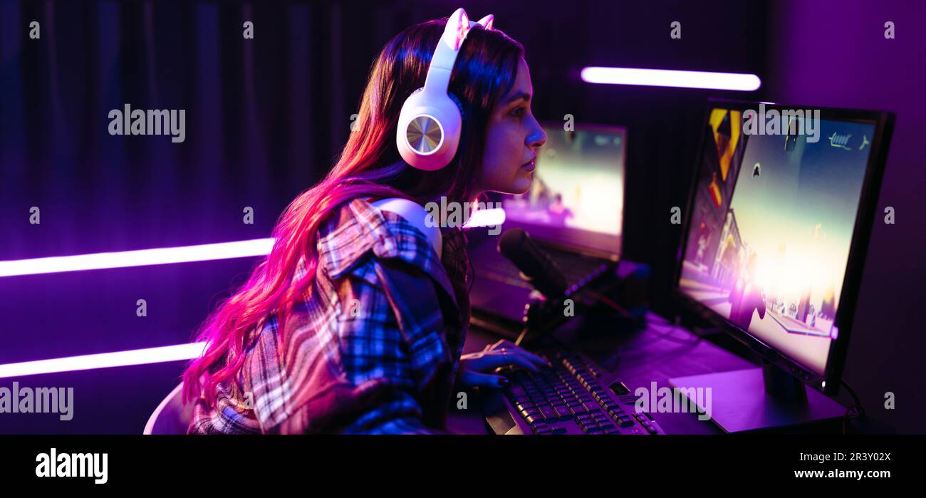 Female gamer playing a first person shooter game on an online platform