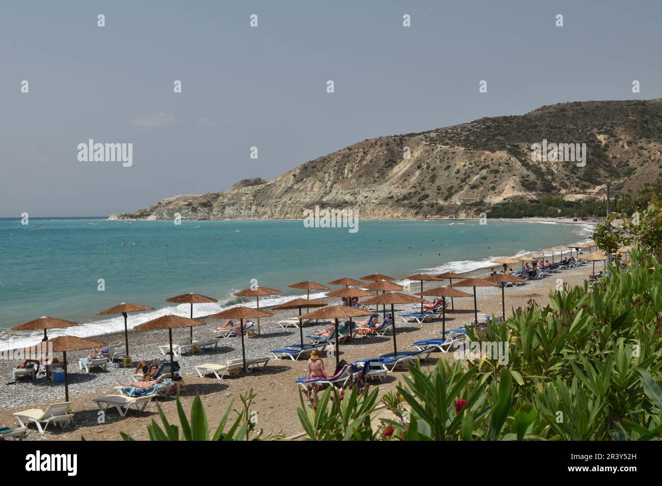 A sunny day in May at the beach at Pissouri, Cyprus, looking across to Cape Aspro. Stock Photo