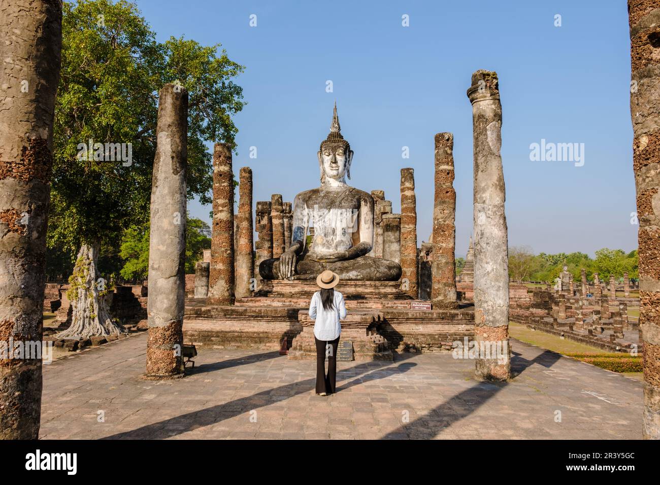 Women visit Wat Mahathat, Sukhothai old city, Thailand. Sukothai historical park Stock Photo