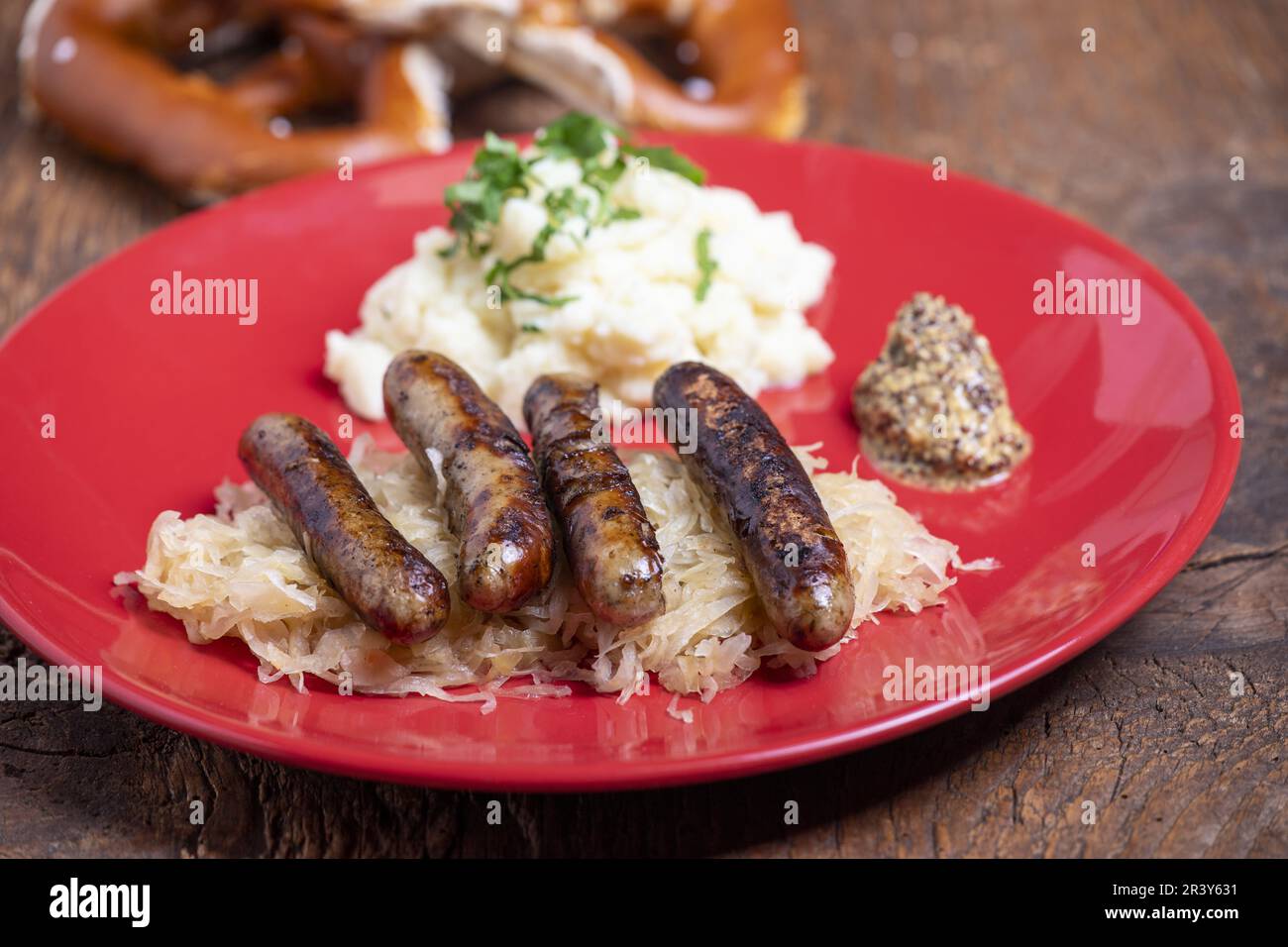 Franconian grilled sausages with sauerkraut Stock Photo