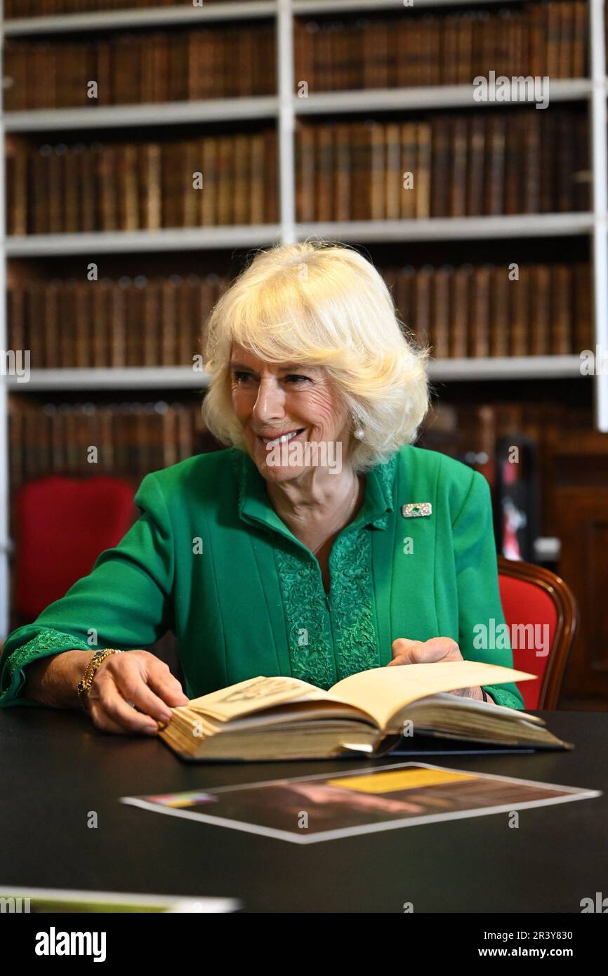 Queen Camilla during a visit to Robinson Library, Armagh, Co Armagh, to continue her work to foster a love of reading across all ages as part of a two day visit to Northern Ireland. Picture date: Thursday May 25, 2023. Stock Photo