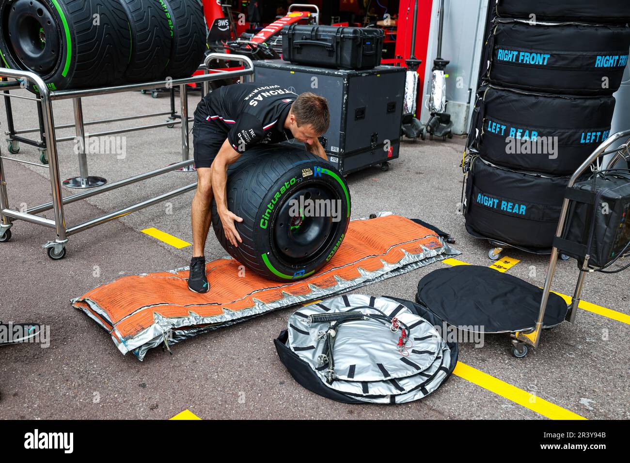 mercedes-amg-f1-team-mechanic-putting-a-pirelli-tyre-in-a-tyre-warmer