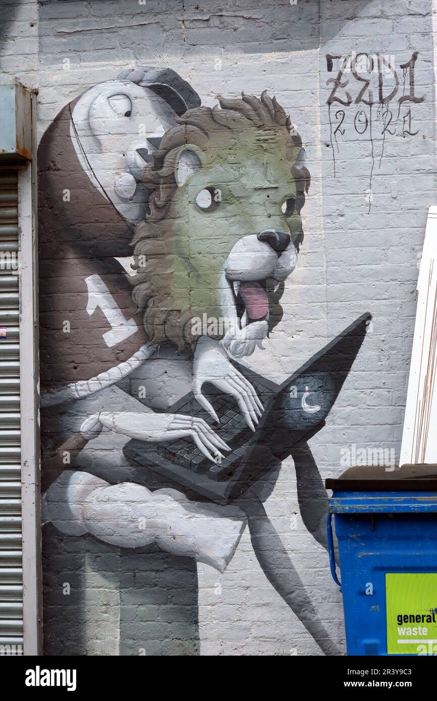 Large colourful street art mural covering the exterior of BAT Studio in Walthamstow, East London, featuring illustrated figures and playful surreal Stock Photo