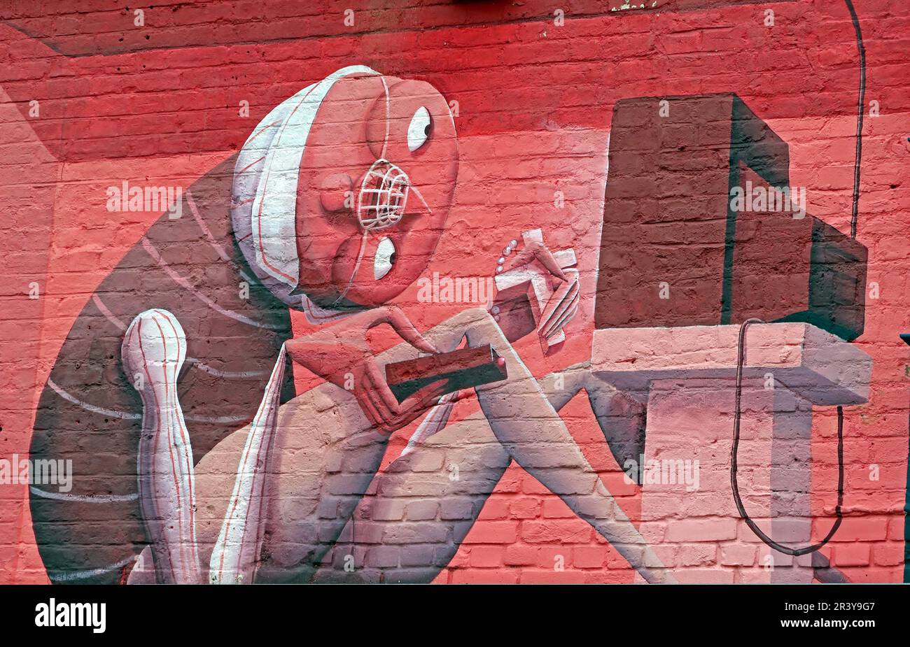 Large colourful street art mural covering the exterior of BAT Studio in Walthamstow, East London, featuring illustrated figures and playful surreal Stock Photo