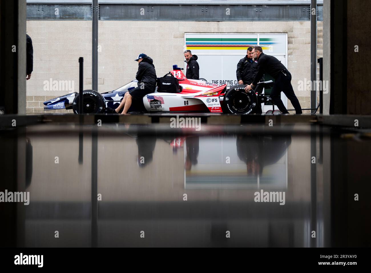 The crew of AJ Foyt racing prepares their race car prior to a practice for the Indianapolis 500 at Indianapolis Motor Speedway in Speedway IN. Stock Photo