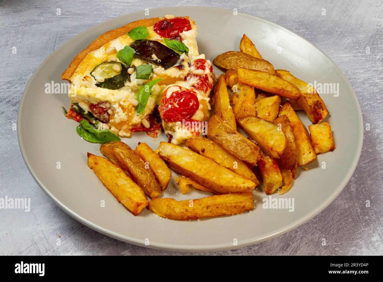 roasted ratatouille & goats cheese tart with chips Stock Photo Alamy