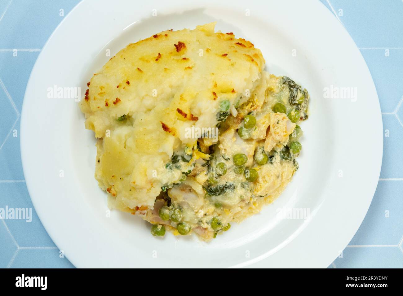 Easy fish pie with peas and spinach, from above Stock Photo