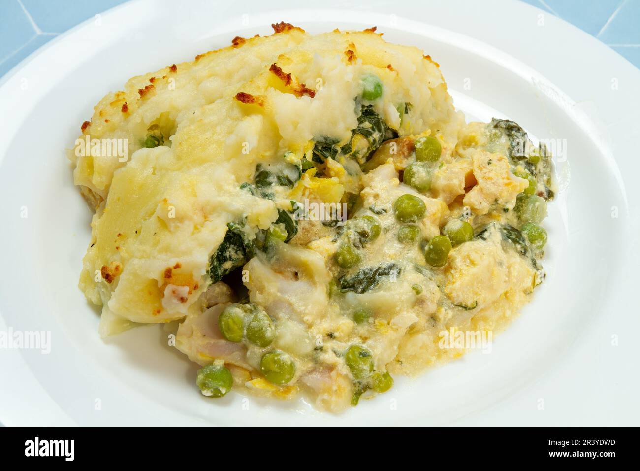 Easy fish pie with peas and spinach Stock Photo - Alamy
