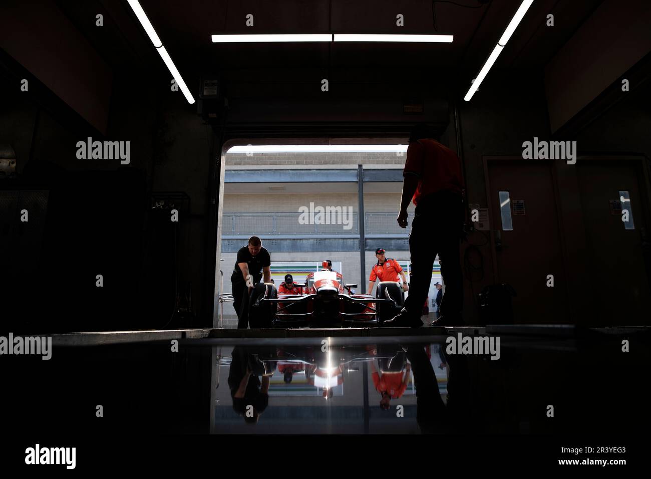 The crew of AJ Foyt racing work on the car following a practice session for the Indianapolis 500 at Indianapolis Motor Speedway in Speedway IN. Stock Photo