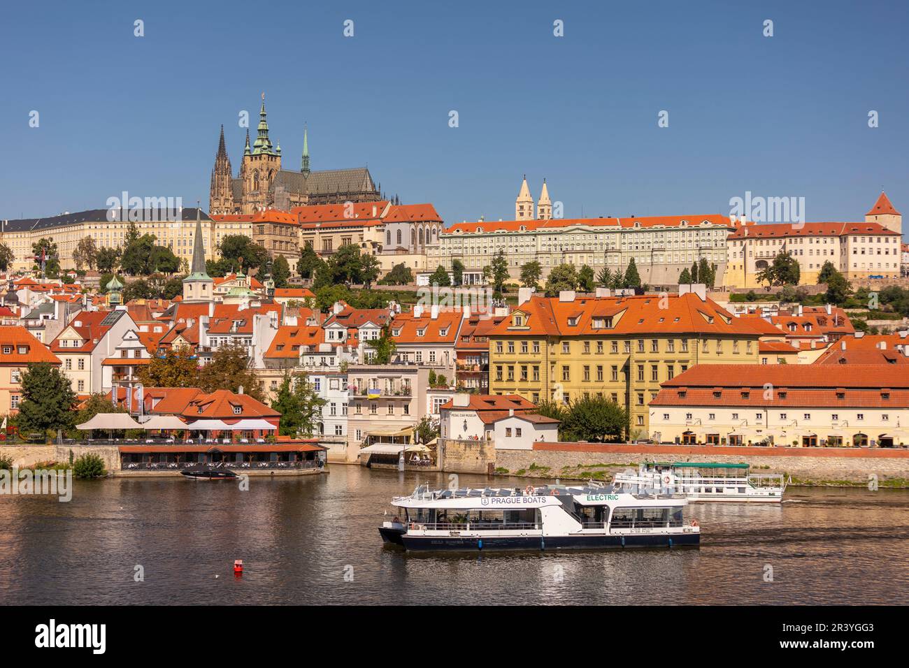 PRAGUE, CZECH REPUBLIC, EUROPE - Prague skyline with Prague Castle and St. Vitus Cathedral and Castle District, Hradcany, on RIver Vltava. Electric bo Stock Photo