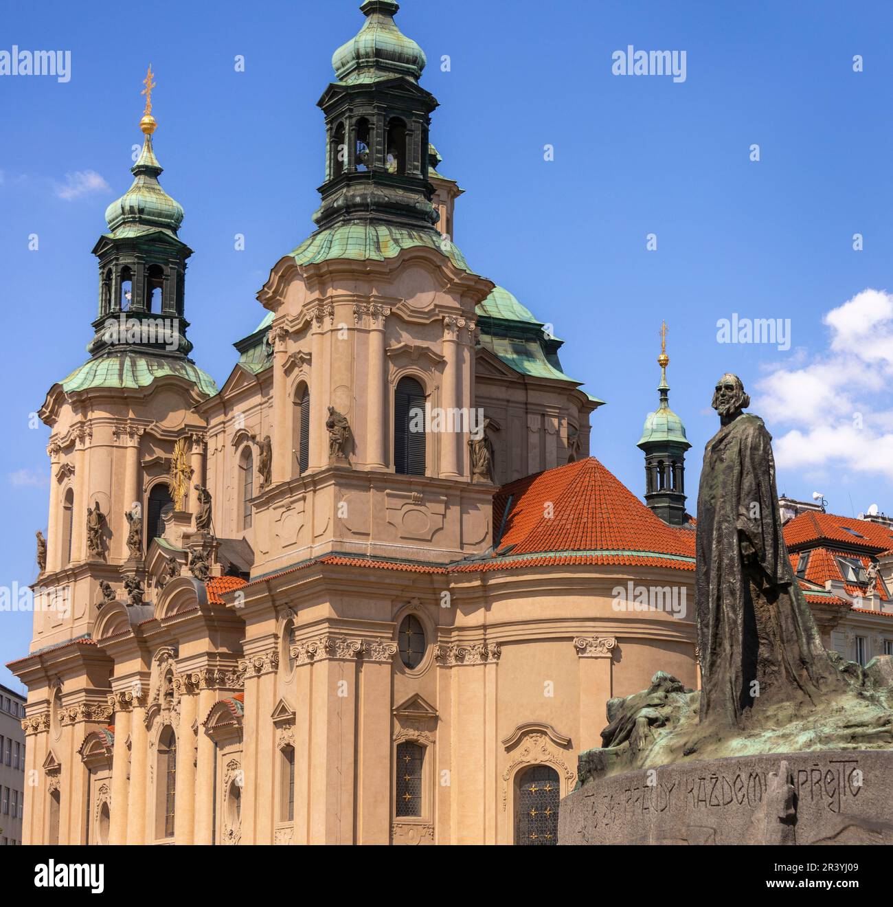 OLD TOWN SQUARE, PRAGUE, CZECH REPUBLIC, EUROPE - Jan Hus Memorial statue at right, and Church of St. Nicholas. Stock Photo