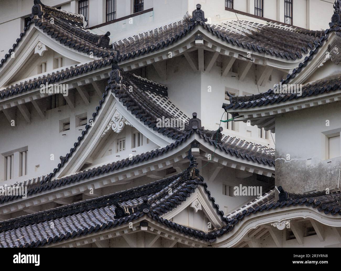 Closeup view of tiles and pitched roof on historic Japanese castle Stock Photo