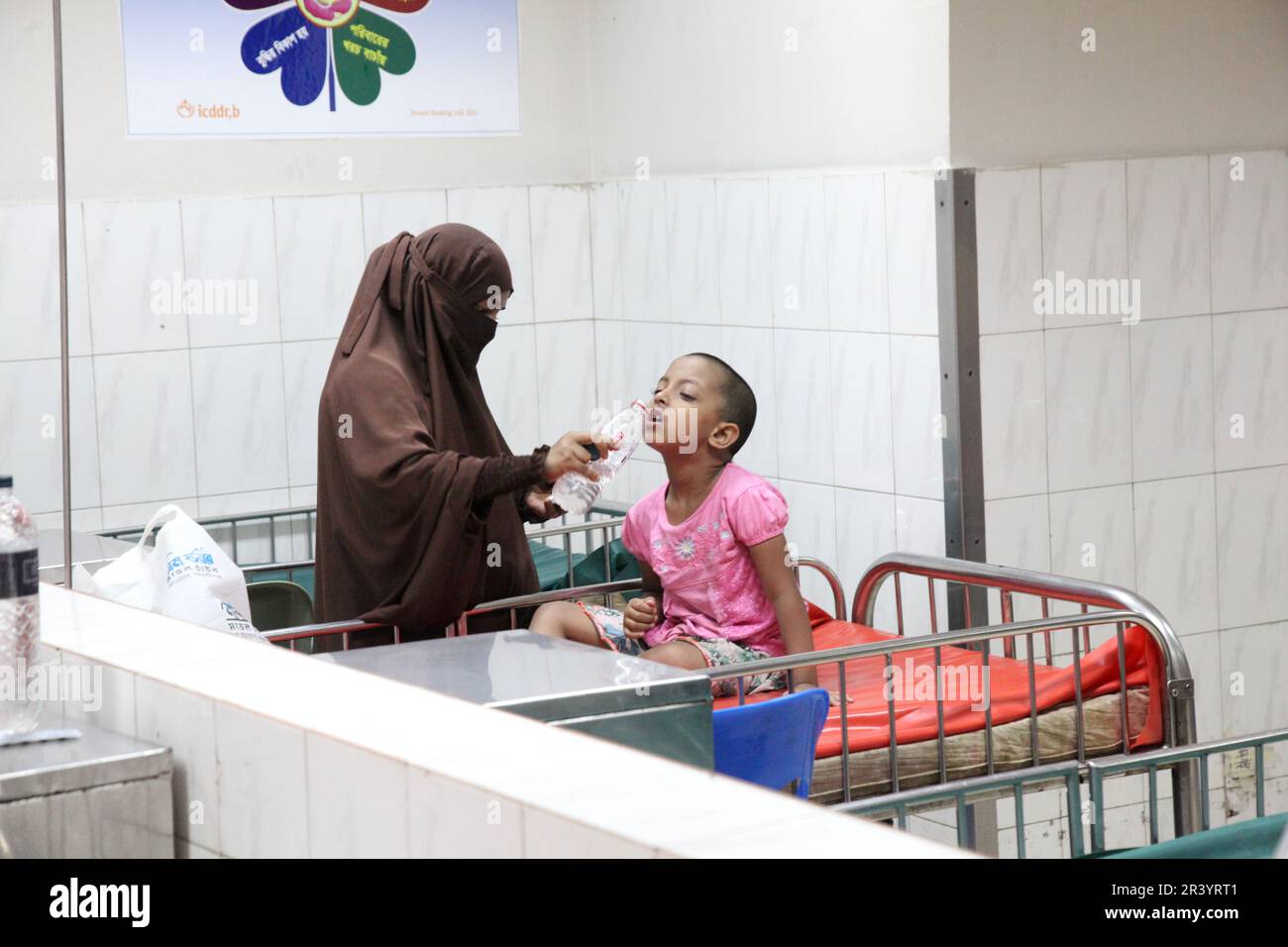 Dhaka, Bangladesh. 09may, 2023. A mother takes care of her baby suffering from diarrhoea in a hospital. Diarrhoea patients are increasing at the Inter Stock Photo