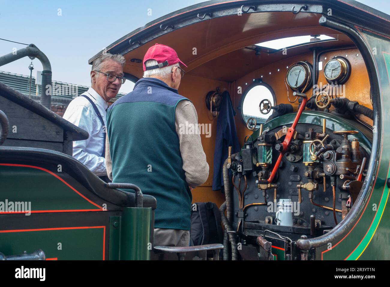 Visitor having a guided tour of Engine No 65,Built for the South Eastern Railway (SER) at Ashford railway works in 1896, and is the only surviving for Stock Photo