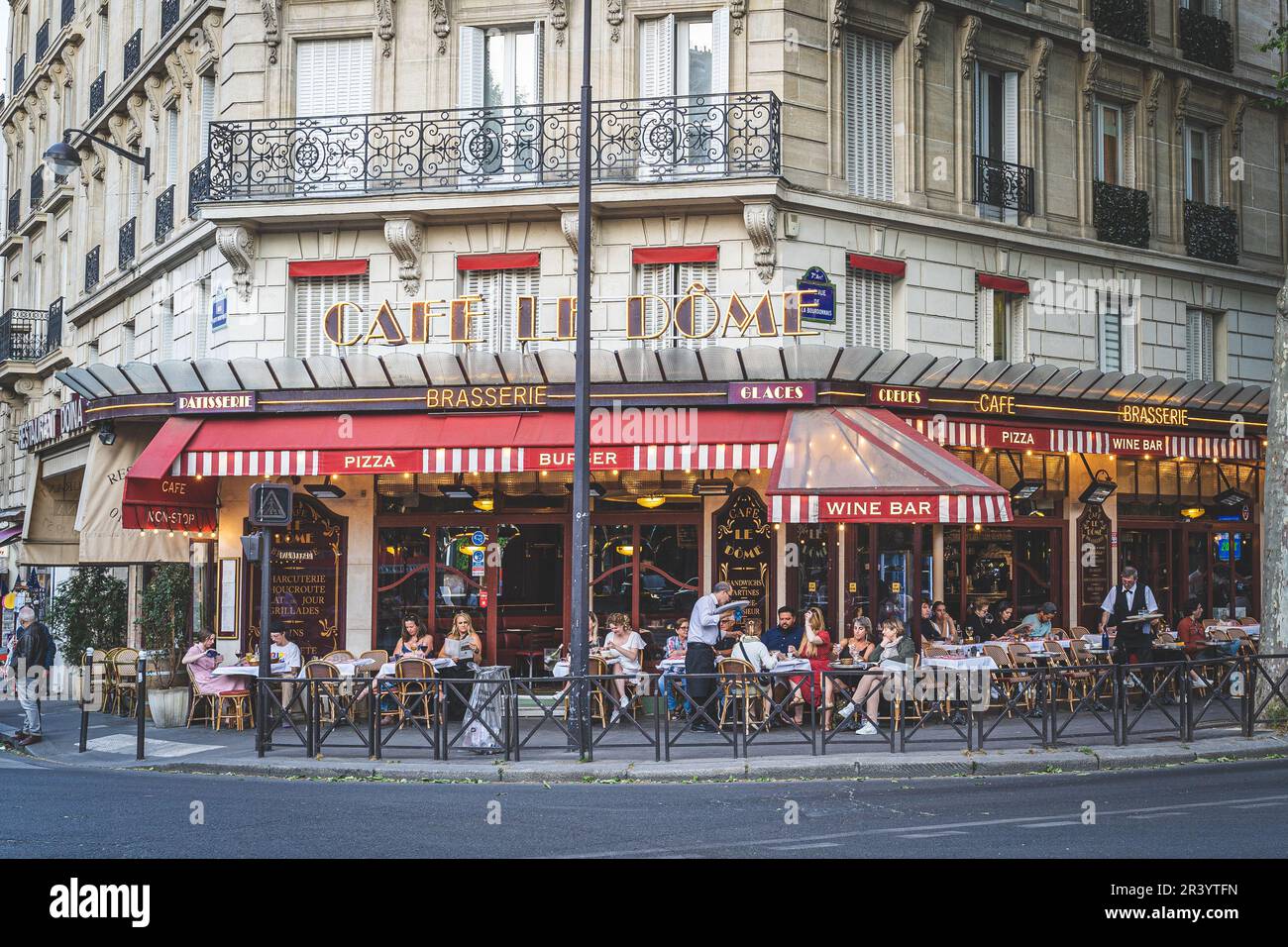 Paris, France - May 10, 2022. View of tourists having dinner a beautiful bistrot in downtown Paris Stock Photo