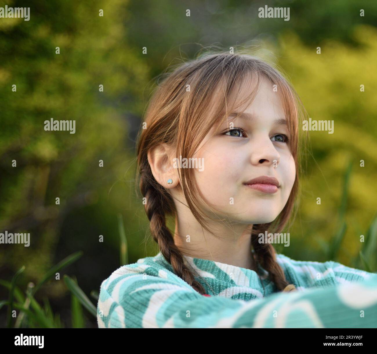 Close up face portrait of beautiful cute blonde young girl posing with confidence Stock Photo