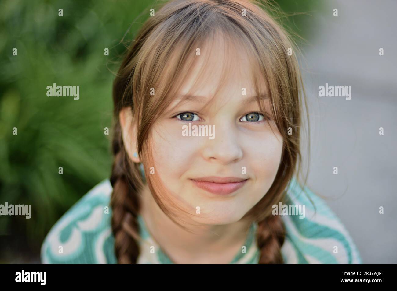 Close up face portrait of beautiful cute blonde young girl posing with confidence Stock Photo