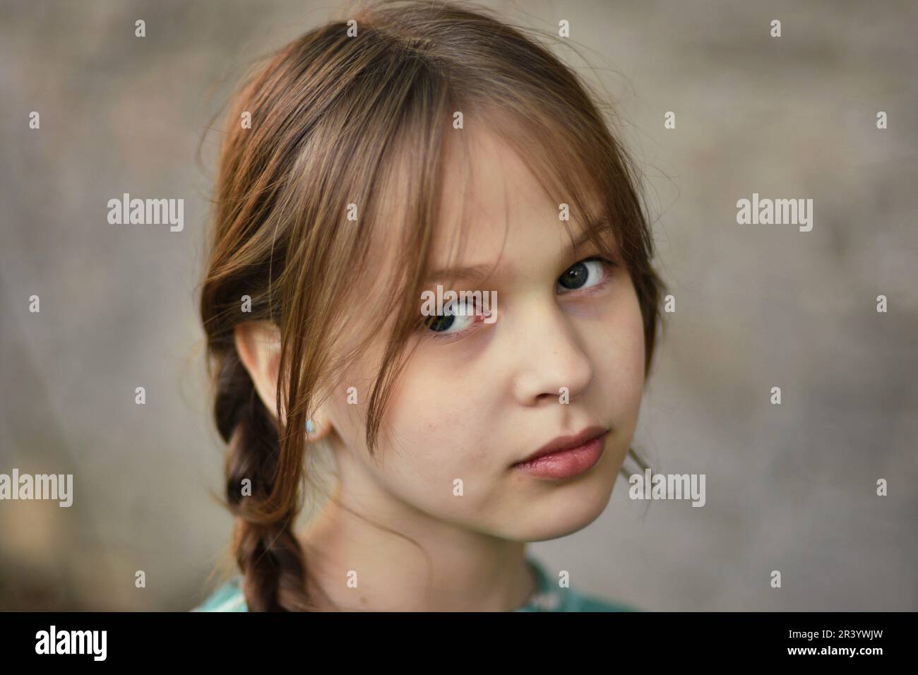 Close up face portrait of beautiful cute blonde young girl posing with confidence Stock Photo