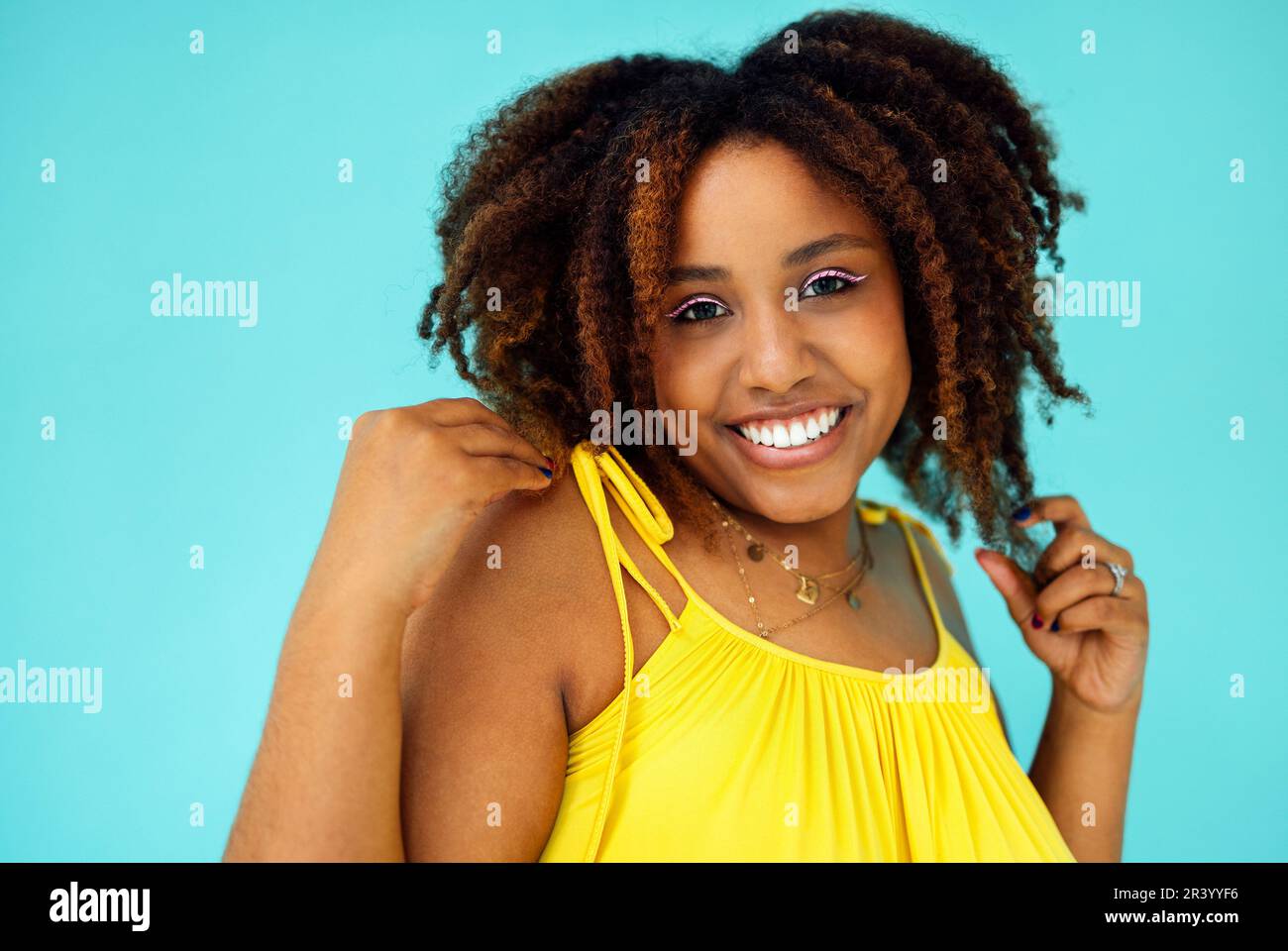 Beautiful bright joyful african woman in yellow dress Stock Photo - Alamy