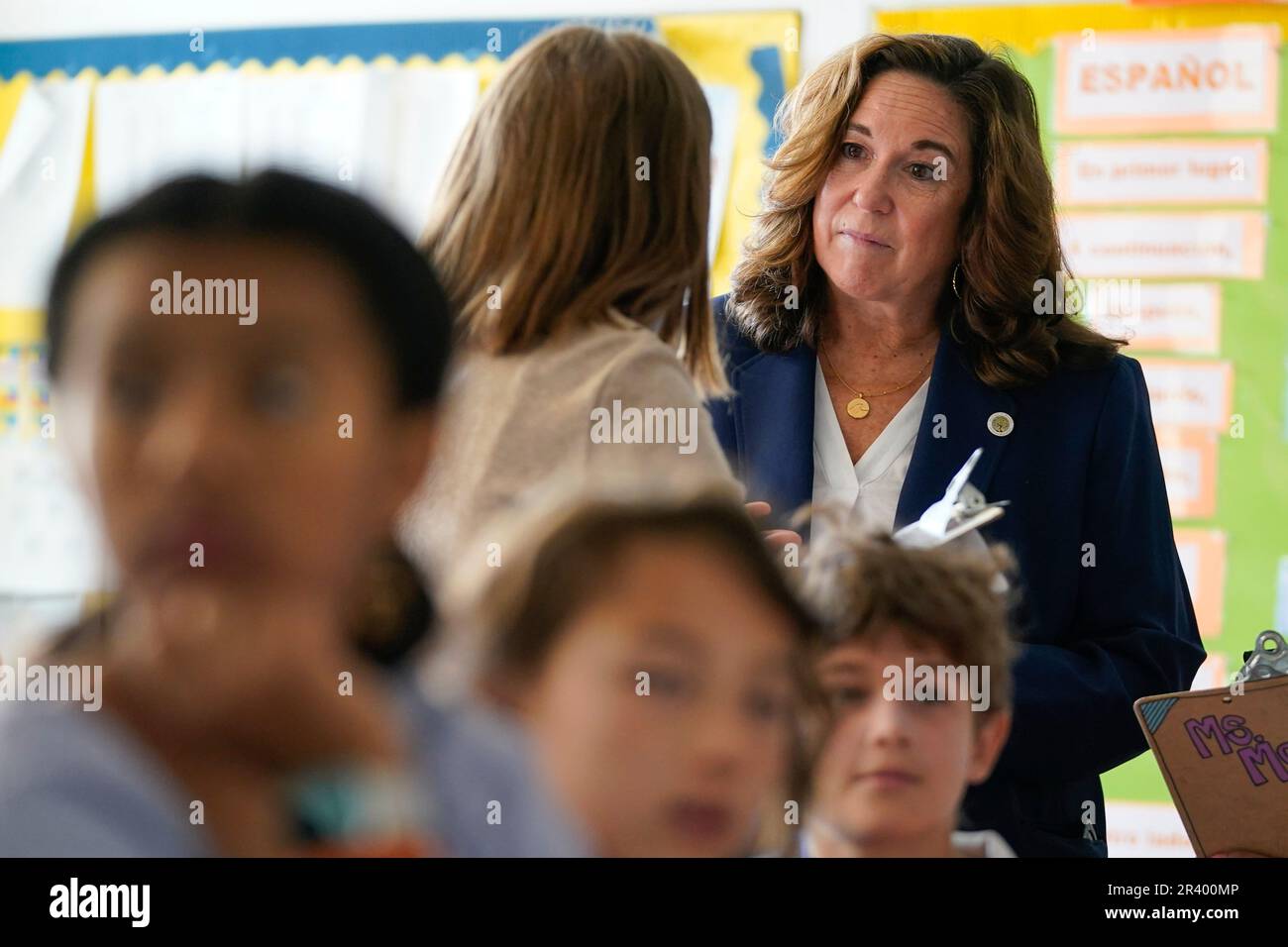 Deputy Secretary of Education Cindy Marten meeting with a student while
