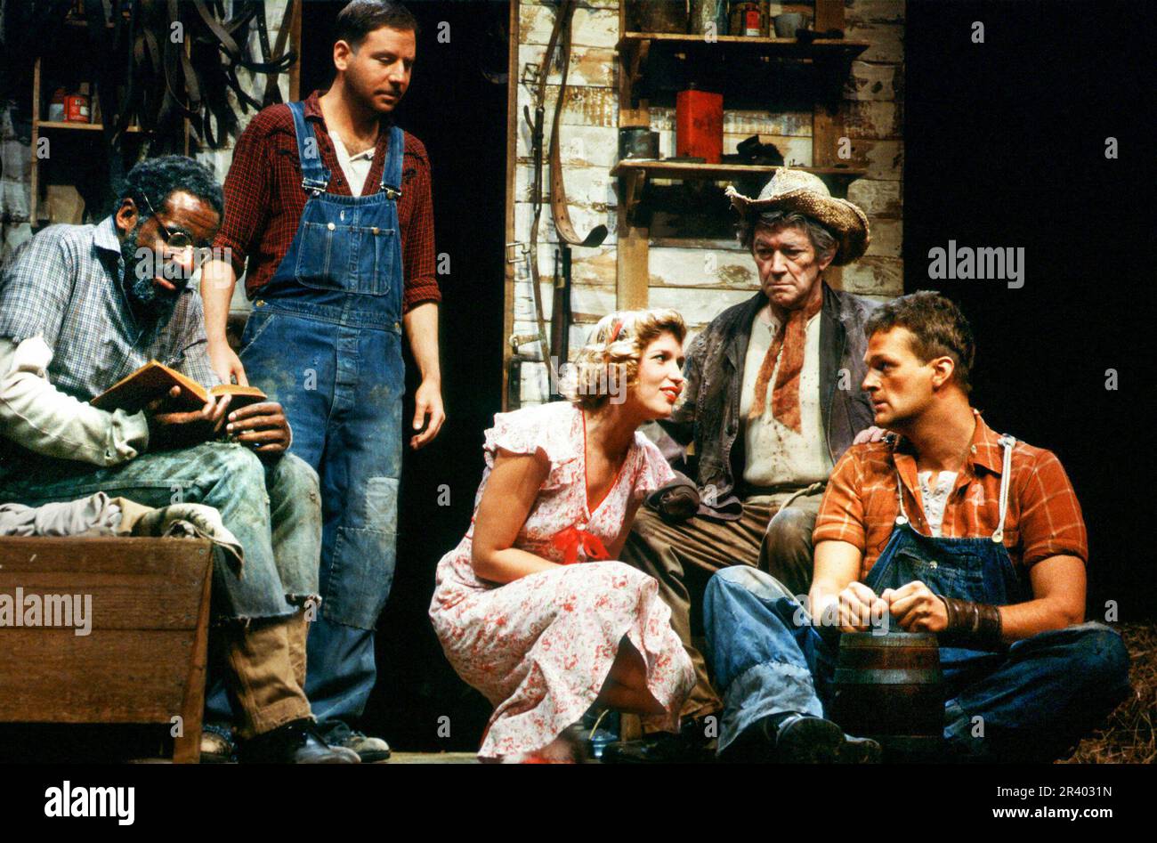 l-r: Calvin Simpson (Crooks), Lou Hirsch (George), Susan Penhaligon (Curley's Wife), Francis Drake (Candy), Clive Mantle (Lennie) in OF MICE AND MEN by John Steinbeck at the Mermaid Theatre, London EC4  11/1984  set design: Sean Cavanagh  costumes: Sarah-Jane McClelland  lighting: Stanley Osborne-White  fights: Peter Woodward  director: Geoff Bullen Stock Photo