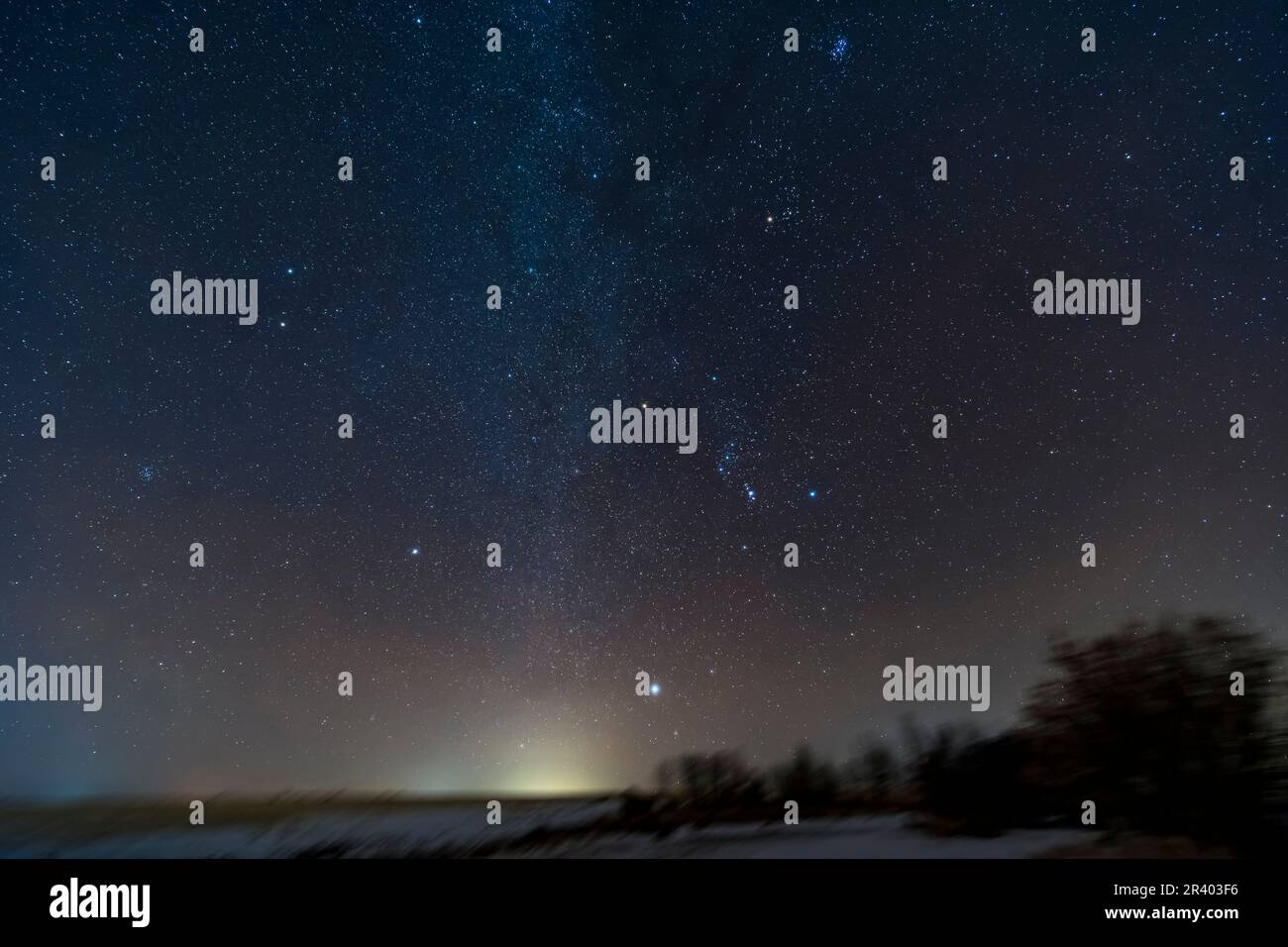 The winter sky rising in the southeast, Alberta, Canada, with bright star clusters along the Milky Way. Stock Photo
