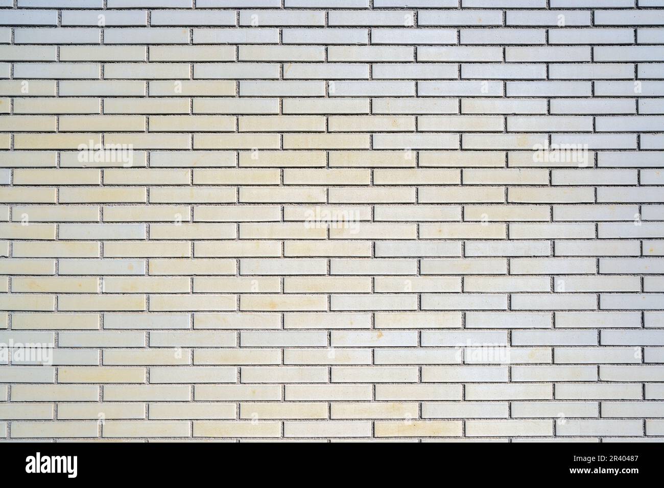 Background from a beige clinkered wall Stock Photo