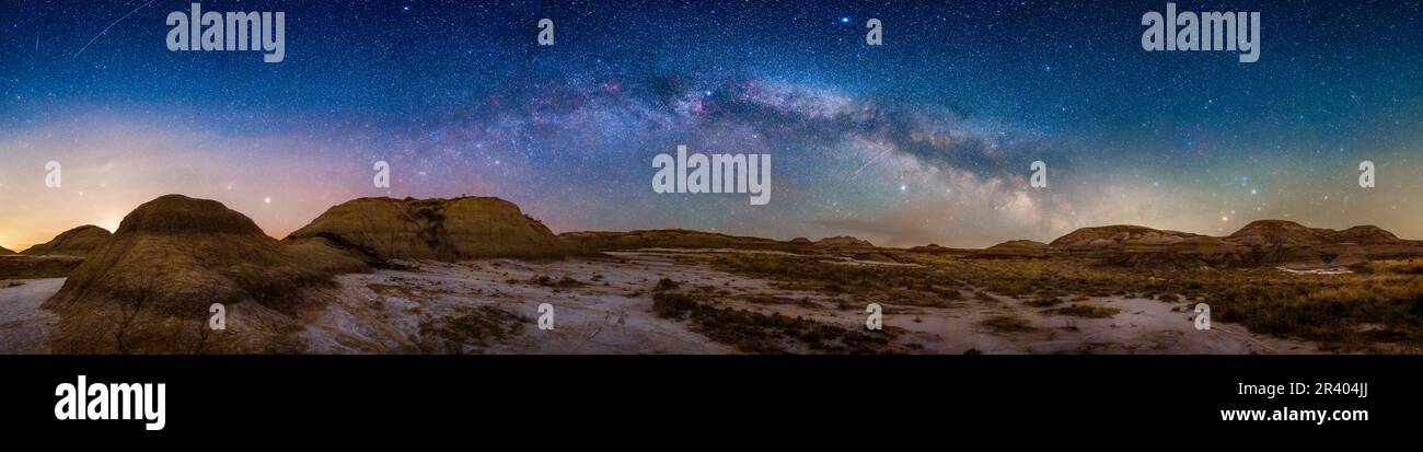 Panorama of the Milky Way rising on a spring night at Dinosaur Provincial Park, Alberta, Canada. Stock Photo