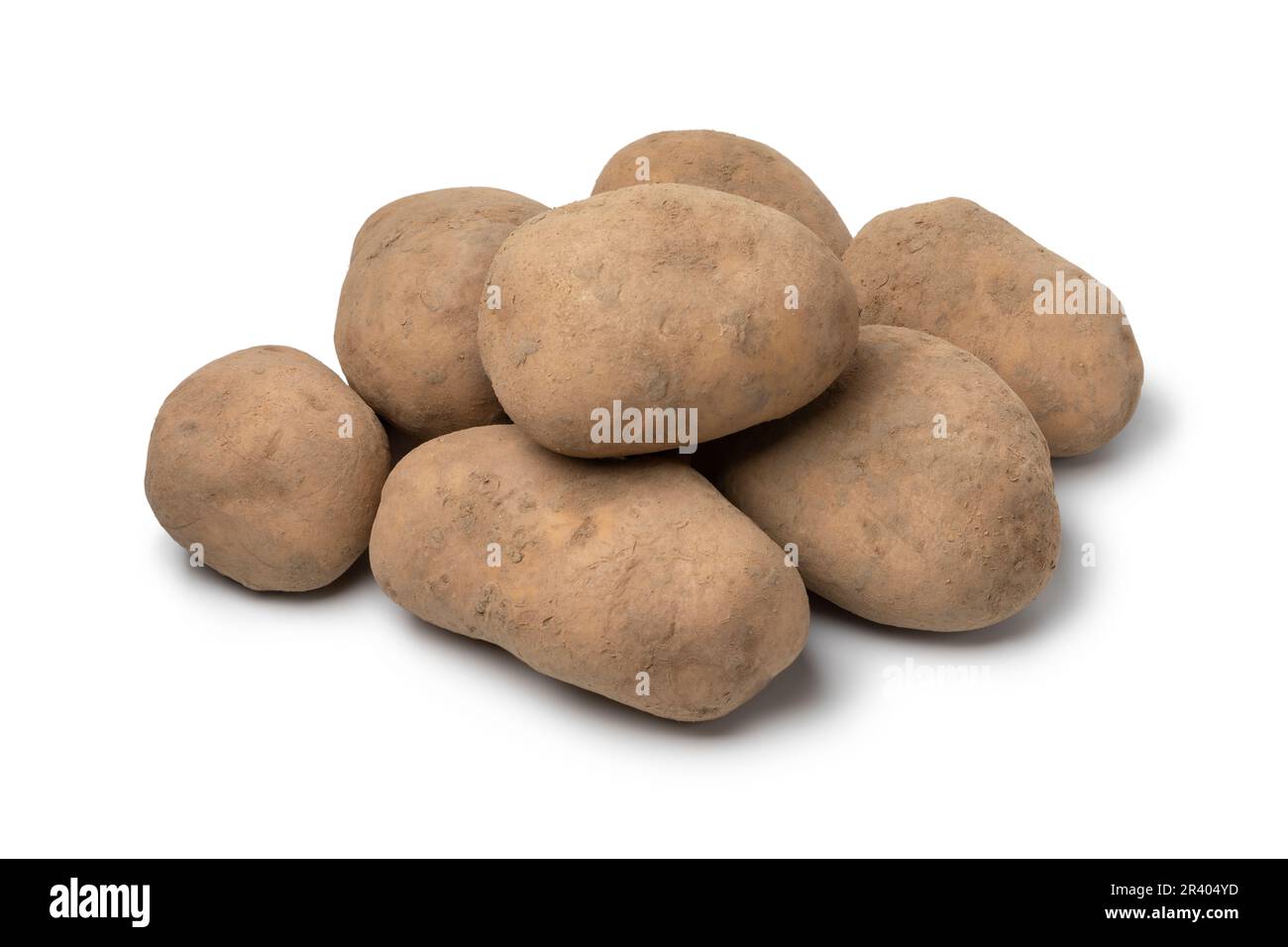 Heap of fresh Dutch variety potato called Bintje close up isolated on white background Stock Photo