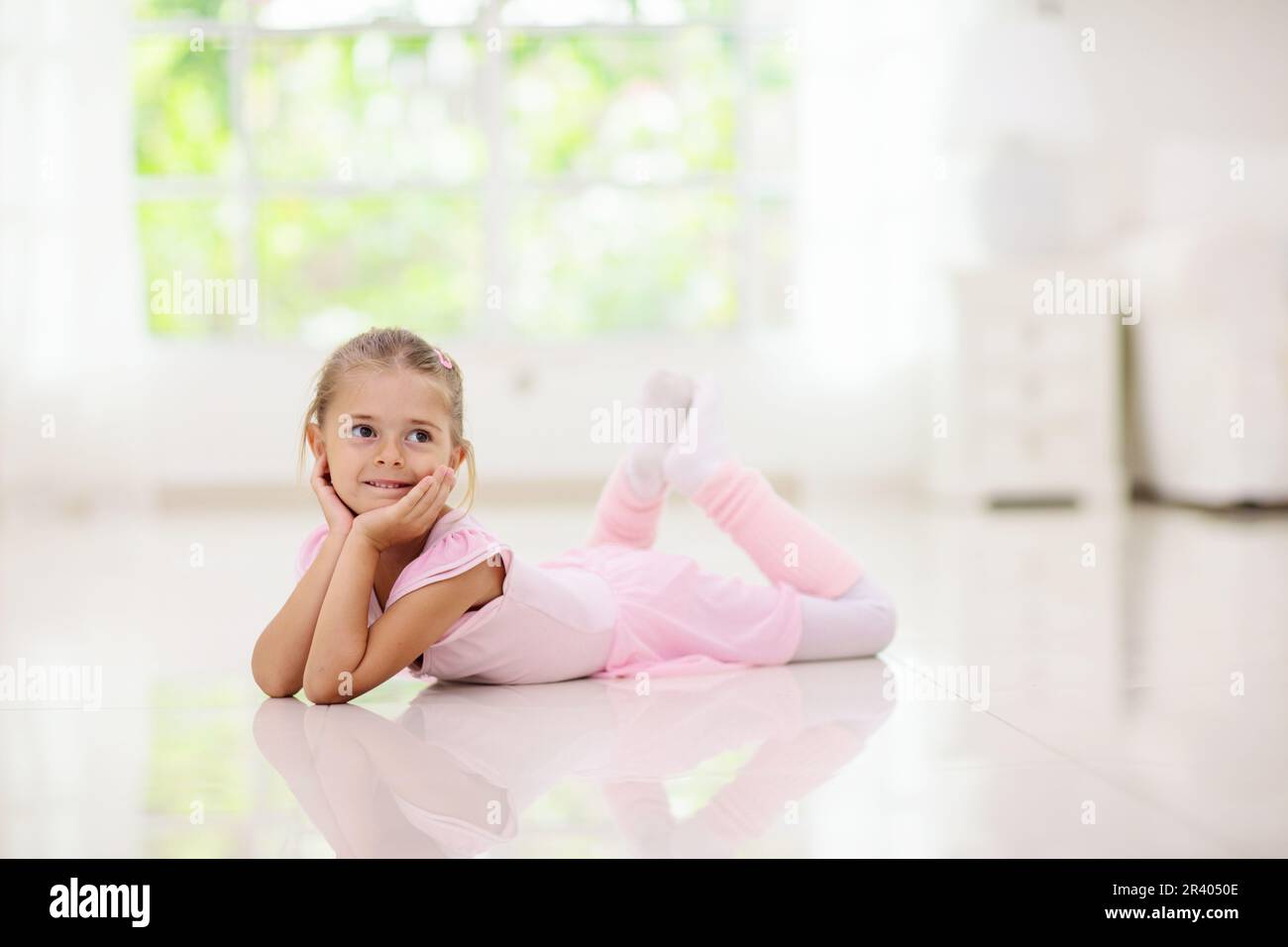 Baby ballet studio. Little ballerina in dance class. Cute girl in pink ...