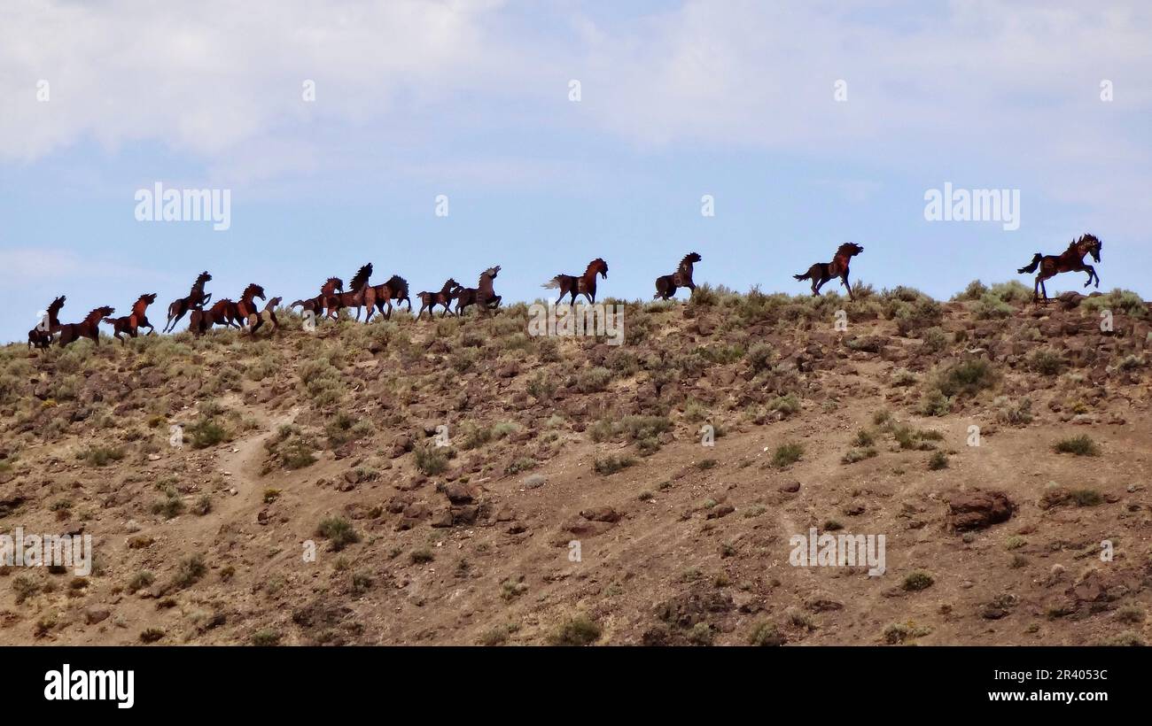 Wild Horses Monument also known as Grandfather Cuts Loose the Ponies, 15 metal sculptures on a ridge above Interstate 90 near Vantage. Washington, USA Stock Photo