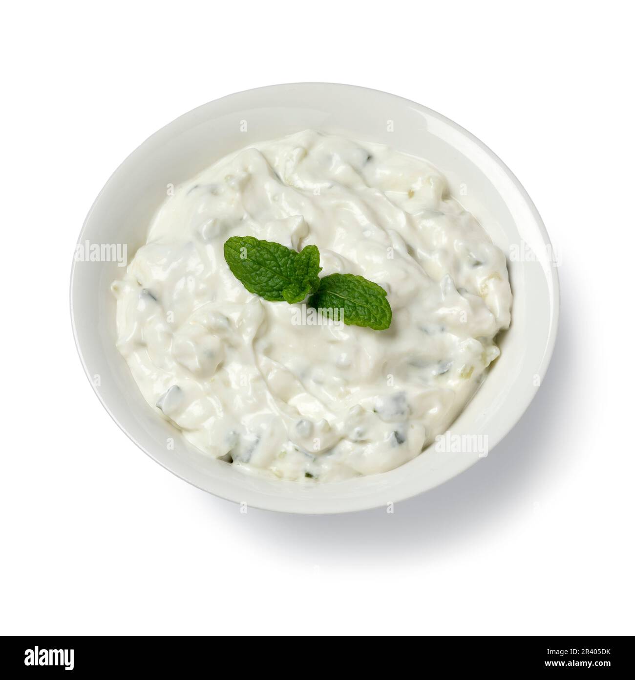 Bowl with traditional Greek tzatziki close up isolated on white ... Bowl with traditional Greek tzatziki close up isolated on white ...