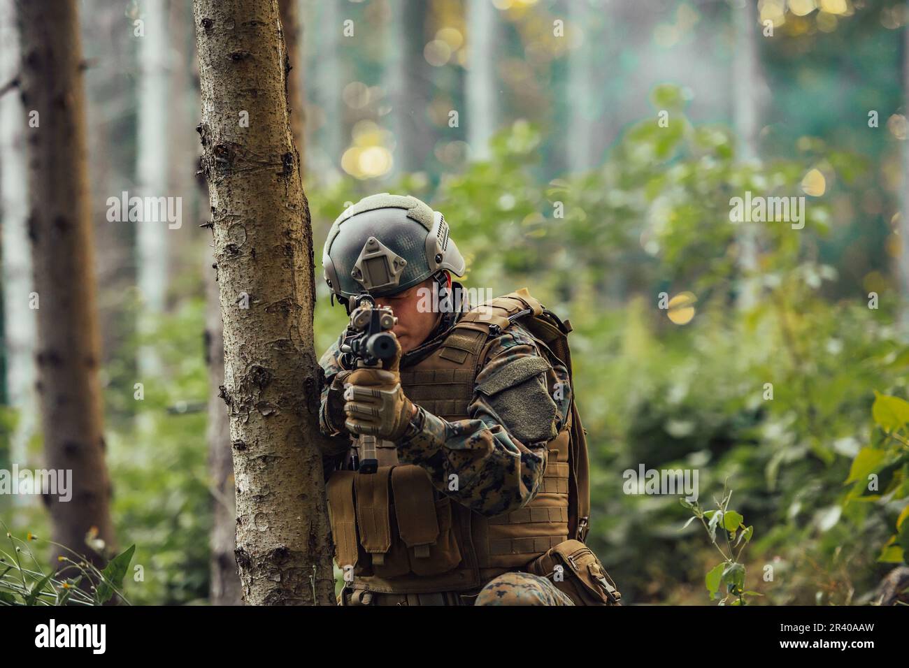 A modern warfare soldier on war duty in dense and dangerous forest ...
