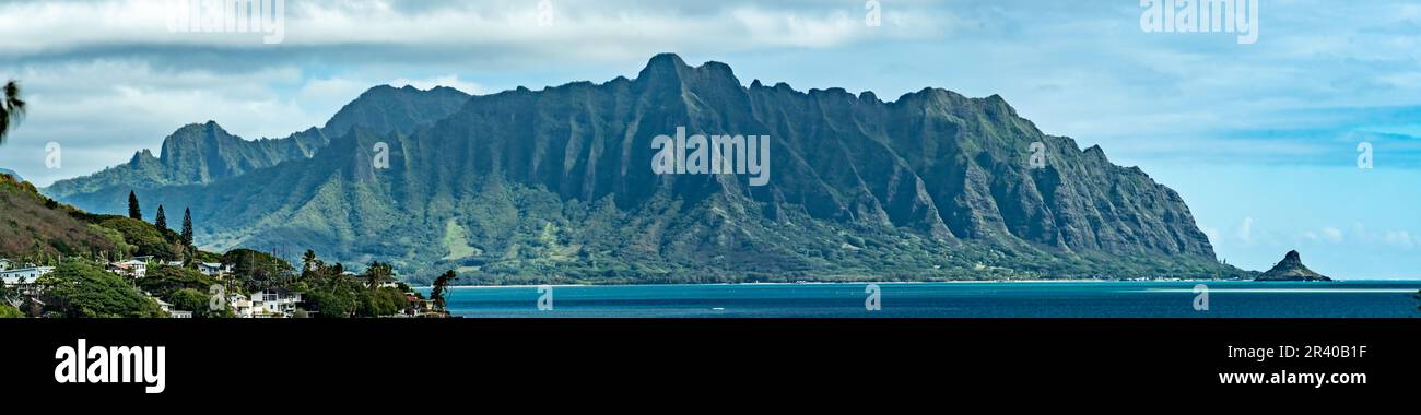 Panorama of tropical lagoon, lush mountains,  and the ocean in Oahu, Hawaii Stock Photo