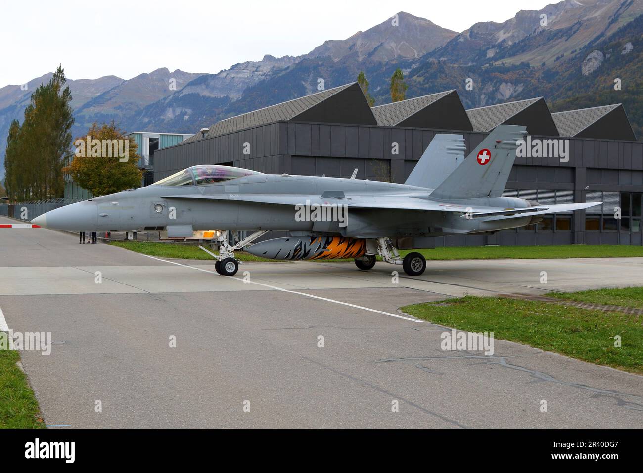 An F/A-18C Hornet jet fighter of the Swiss Air Force taxiing at an airbase in Meiringen, Switzerland. Stock Photo