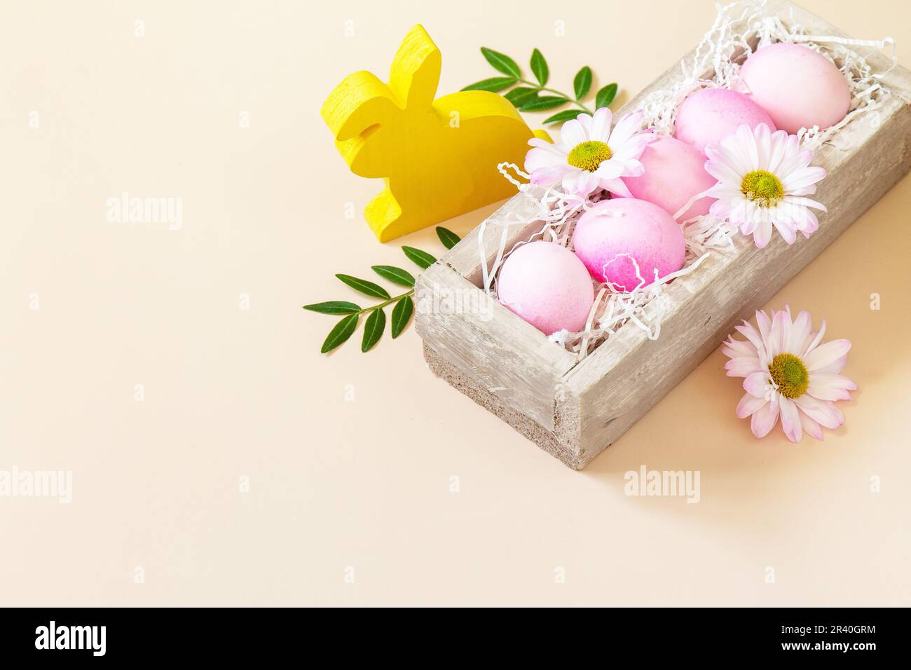 The minimum concept of Easter. Easter Eggs painted pink eggs on trendy pastel background. Copy space. Stock Photo