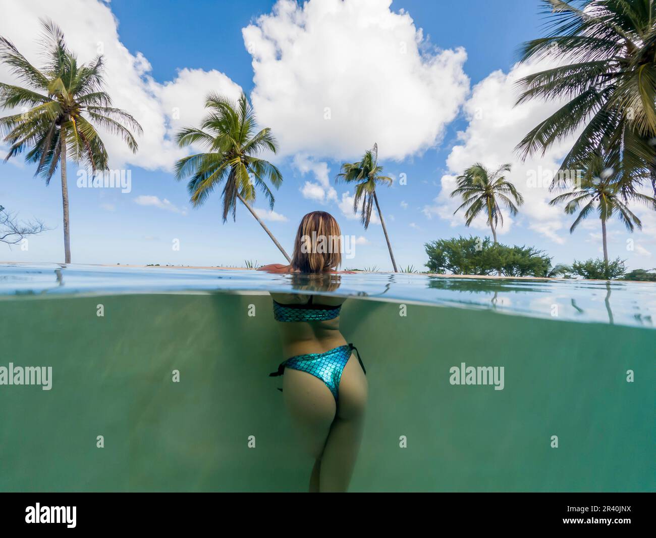 A Lovely Latin Model Enjoys A Day Pool Near The Caribbean Sea Stock Photo